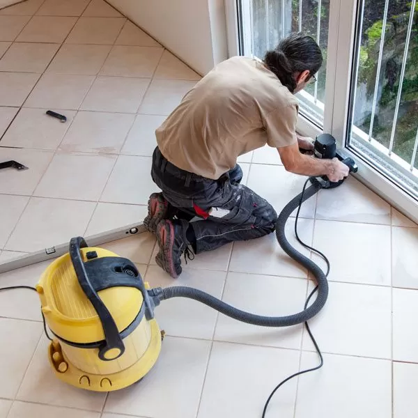 worker doing floor resurfacing work